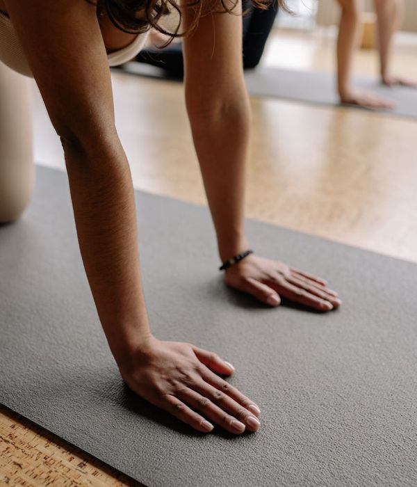 Woman in a calm yoga pose, embodying inner balance and strength.